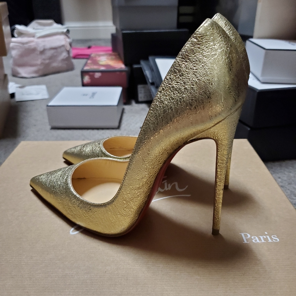 Christian Louboutin So Kate gold pumps